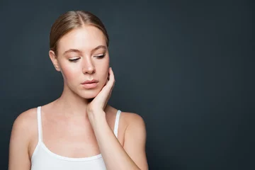 Nice woman on gray background portrait