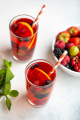 Fresh summer berry drink with lemon and mint.