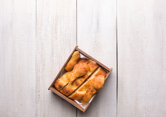 Traditional national Georgian Shoti bread on a white wooden background.