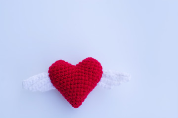 Fototapeta premium Beautiful red heart on a natural bokeh background. Valentine's Day .