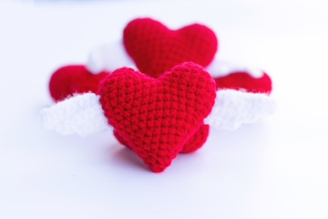 Fototapeta premium Beautiful red heart on a natural bokeh background. Valentine's Day .