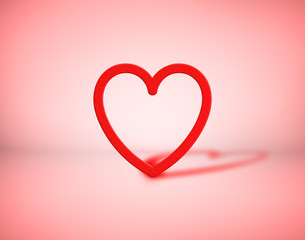 Red heart on pink background. Romantic symbol of love and Valentine's Day.
