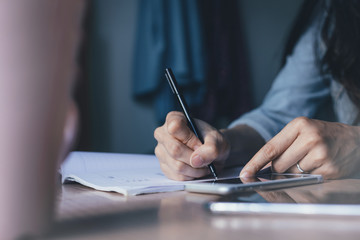 contact marketing businessman professional people thinking while working writing information documents in home offices at desk with computer,laptop,cell phone,business report chart