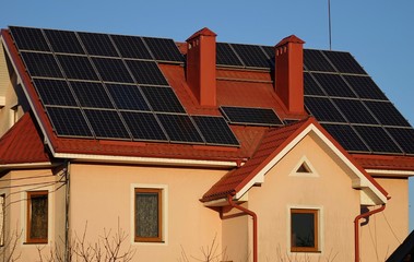 Roof of a house with solar panels, alternative energy sources