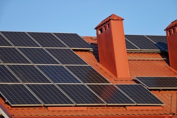Roof of a house with solar panels, alternative energy sources