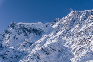 The Monte Rosa, one of the most beautiful peaks in the Italian Alps, during a sunny winter day, near the town of Macugnaga, Italy- December 2019.