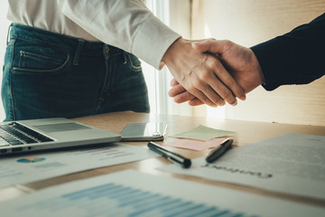 handshake business partners agree to contract Real Estate Venture International trade,contract investment in meetings vision to invest for profit.