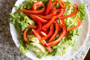 Rocket leaves, lettuce with red pepper sliced