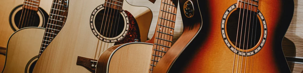 Aluminium Prints Music store banner guitars are displayed in a row in a music store