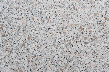 Top view gray background with small spots of different colors, marble crumb, kitchen worktops