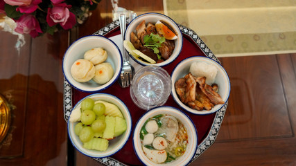 Close-up Thai food on rattan trays Offering to monk0               