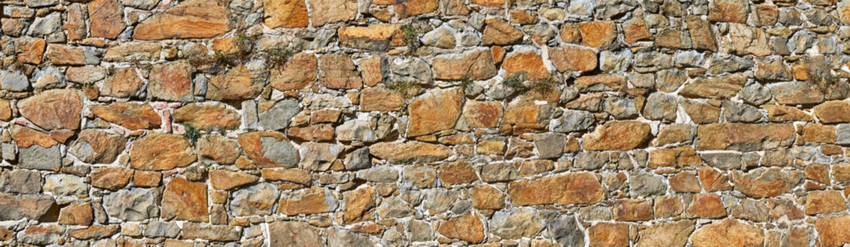 Old unplastered castle wall, close-up.