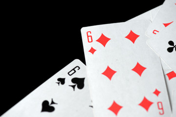 Playing cards on a black background close-up. Gambling Concept