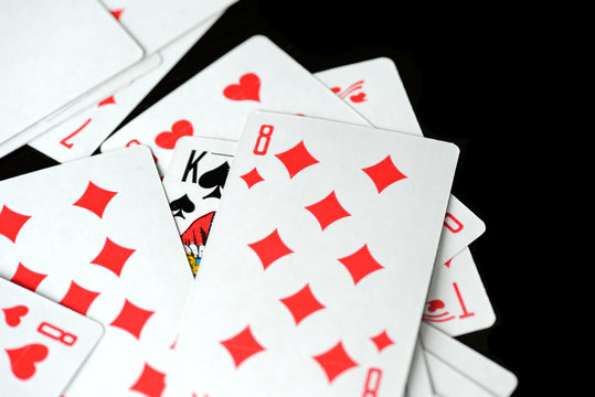 Playing cards on a black background close-up. Gambling Concept