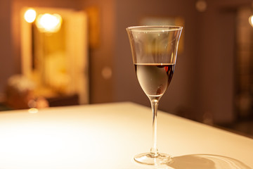 Glass of red wine in a cozy interior