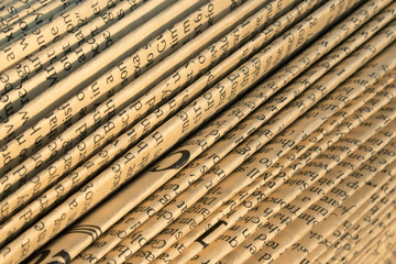 Abstract folded old paper with English text