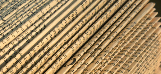 Abstract folded old paper with English text