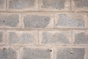 Texture of an old gray concrete wall made of blocks. Building a house. Horizontal background.