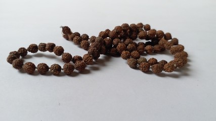 Rudraksh garland on white background 