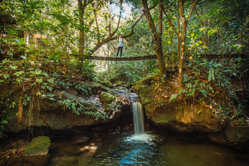 Fototapeta premium A young woman visiting the Cerro Azul Meambar National Park (Panacam) on Lake Yojoa. Honduras