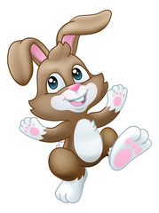 The Easter bunny rabbit cartoon character waving and dancing or hopping along