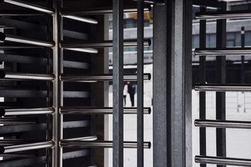 Full-height metal turnstiles in the stadium.