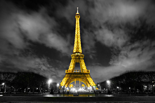 PARIS  France - DECEMBER 05, 2012: Lighting the Eiffel Tower on iParis. Established in 1985, the new system allowed the tower to glow golden. The Eiffel tower is the most visited monument of Paris