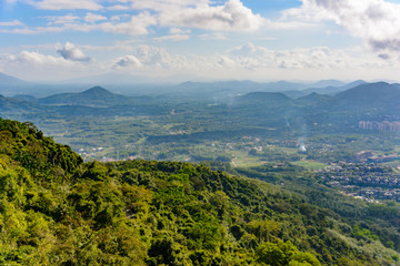 Panoramic view to mountains, tropical forest, Yanoda Park and Sanya city. Rainforest cultural tourism zone Yanoda, Hainan island, Yalong Bay Tropical Paradise Forest Park. China.