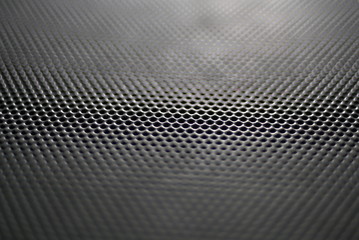 Metallic background with perforation of round holes 