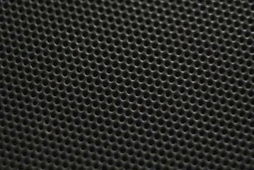 Metallic background with perforation of round holes 