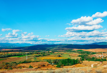 Fields and mountains of Provence, France. Electric towers, agriculture, farming.