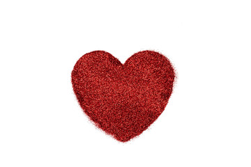 Particles heart shaped against white background