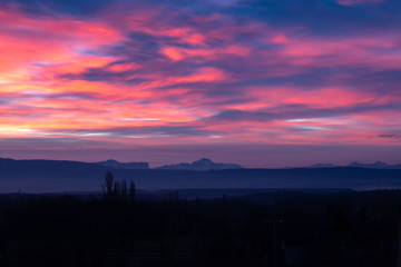 Morning sky with different colors. Colorful dawn in the mountains.