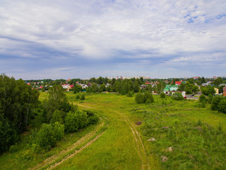 Fototapeta na wymiar Summer landscape near the forest with a bird's eye view.