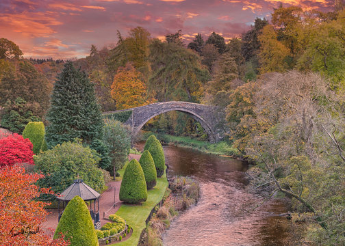 BrigO-Doon and Ayrshire Gardens that Commemorate Burns in Autumn and the Old Brigg at sunset Alloway By Ayr Scotland.