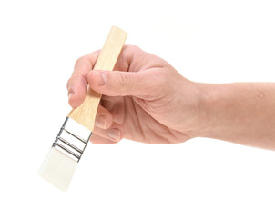 Hand holding brush isolated on white 