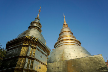 Naklejka premium Two golden pagodas against the sky