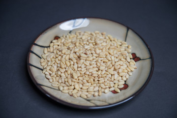 pine nuts isolated on black background