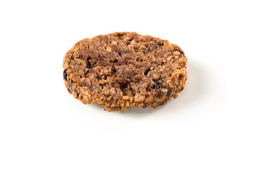 Upside down oatmeal cookie with walnut and raisin isolated on white background
