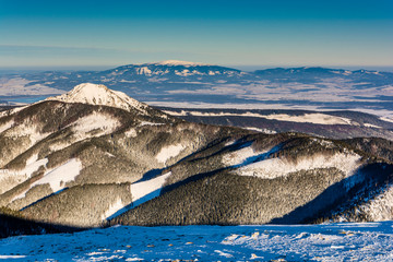 View of the winter landscape with the peak of Osobita in the Slovak Western Tatras. In the...