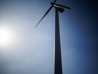 Wind turbine silhouette with backlight sunshine