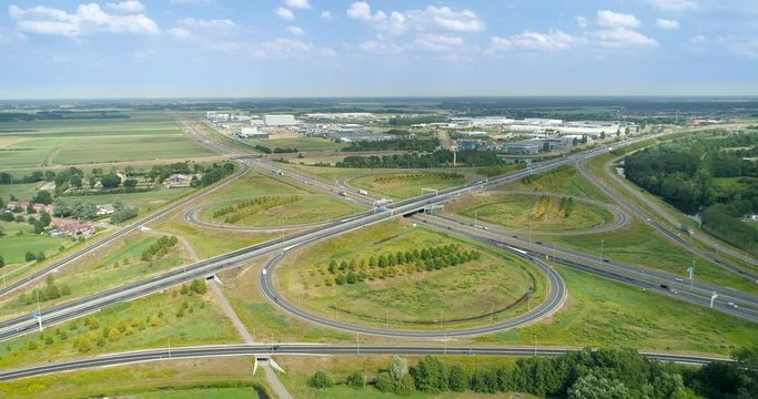 The Heerenveen Highway Intersection of A32 and A7, Clouds Moving on a Sunny Day, Slight Pan to the Left - Friesland, Netherlands / Holland &ndash; 4K Drone Footage