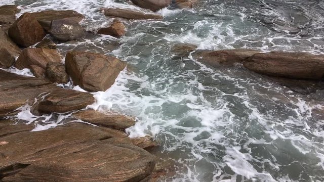 Water waves breaking themsleves on rocks on the beach at Shelley Cove near Dunsborough in Yallingup National Park, Western Australia