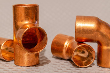 Obraz na płótnie Canvas Copper water pipe fittings plumbing concept or repair water supply
