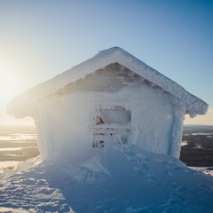 Beautiful vibrant aerial winter mountain view of ski resort, sunny winter day with slope, piste and...