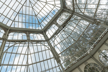 Iron and glass house construction.  Large roof made of Iron and glass materials