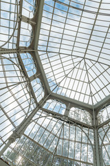 Iron and glass house construction.  Large roof made of Iron and glass materials