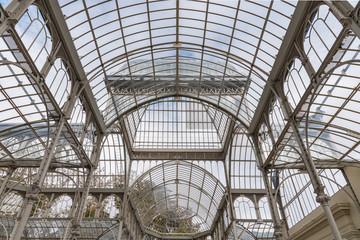 Iron and glass house construction.  Large roof made of Iron and glass materials