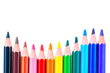 color wave concept, row of colored pencils on a white background isolated