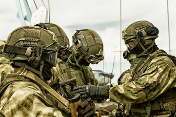 The commander of the swat group checks the ammunition of his fighters at a briefing. The concept of...